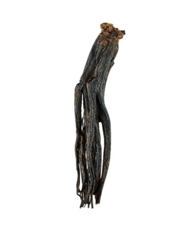 Premium Korean black ginseng roots and extract capsules displayed on a wooden tray