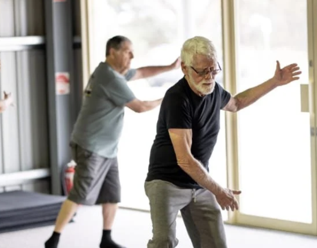 tai-chi-balance-training-older-adults Older adults practicing tai chi for balance and healthy aging