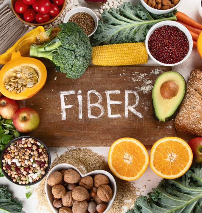 High-fiber foods including beans, berries, vegetables, oats, nuts, and seeds